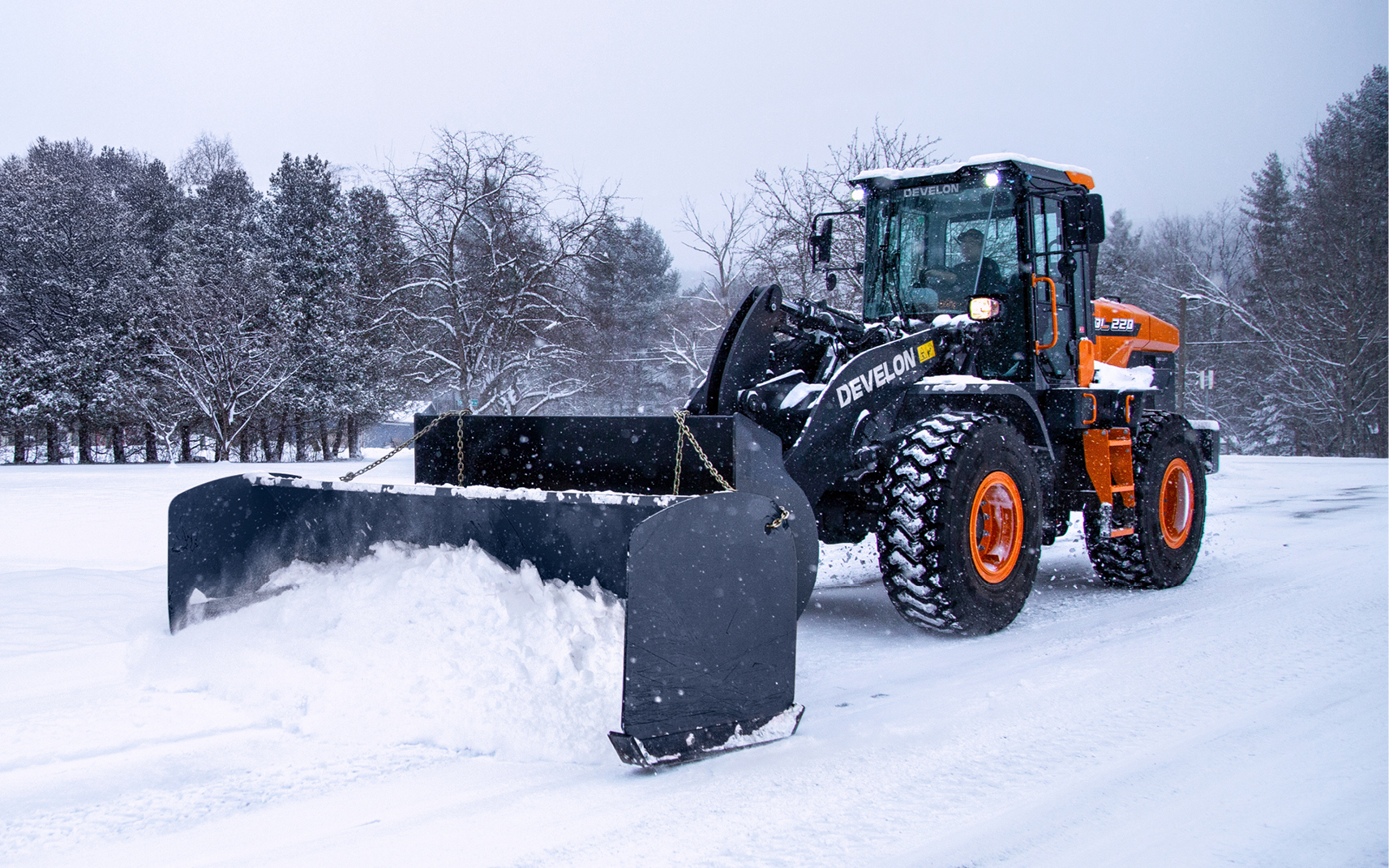 Wheel Loader Dumping Snow