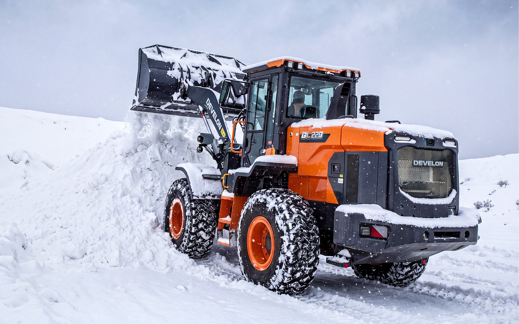 Wheel Loader Dumping Snow